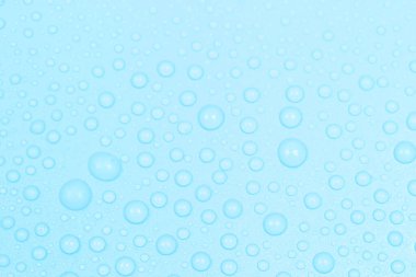 Kozmetik pastel kavramı. Su damlaları mavi arkaplanda