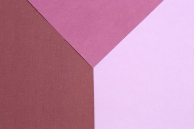 Morun ve pembenin geometrik arka planı. Boşluğu kopyala, metin için yer belirle. Üst görünüm.