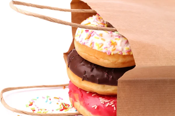 Donuts fritos em sacos de compras de papel — Fotografia de Stock