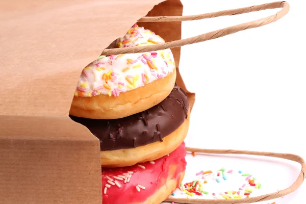 Donuts fritos em sacos de compras de papel — Fotografia de Stock