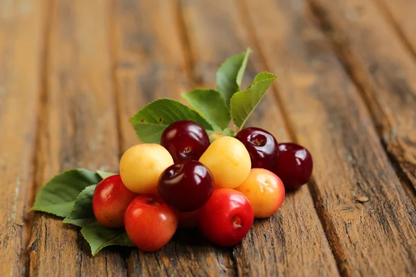 Fresh sweet cherries on old wooden background retro vintage — Stock Photo, Image