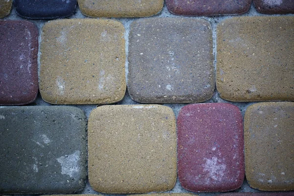 Bakgrunden stenhuggeri kullersten trottoar — Stockfoto