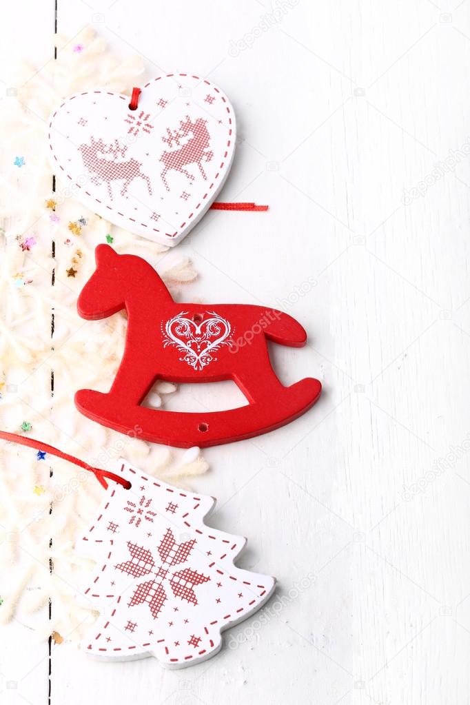 xmas composition Christmas card wooden toys on a white wooden background heart horse fir new year winter