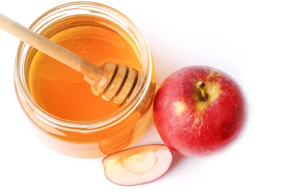 Appel met honing geïsoleerd op een witte achtergrond — Stockfoto