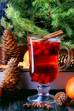Christmas hot drink with cranberries and cinnamon fir mandarin oranges winter holiday