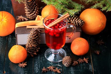 Christmas hot drink with cranberries and cinnamon fir mandarin oranges winter holiday