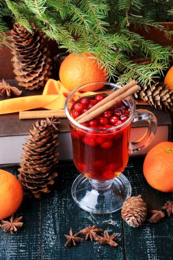 Christmas hot drink with cranberries and cinnamon fir mandarin oranges winter holiday