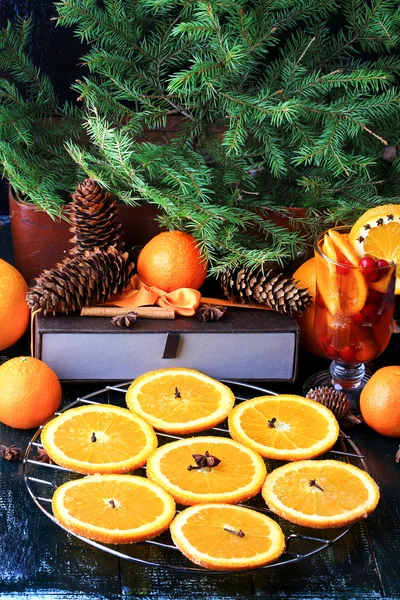 Christmas composition of preparation for drying oranges hot drink with cinnamon, anise tangerine cranberry fir vintage style on old wooden background — Stock Photo, Image