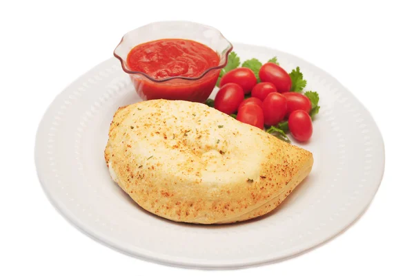 Plated Calzone with Tomato Dipping Sauce & Fresh Tomatoes — Stock Photo, Image