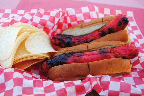 Grilled Hot Dogs Served with Chips — Stock Photo, Image