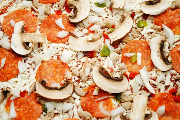 Back Ground of a Raw Meat and Veggie Pizza — Stock Photo, Image