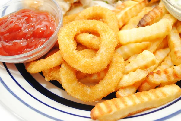 Serving of Onion Rings and French Fries — Stock Photo, Image