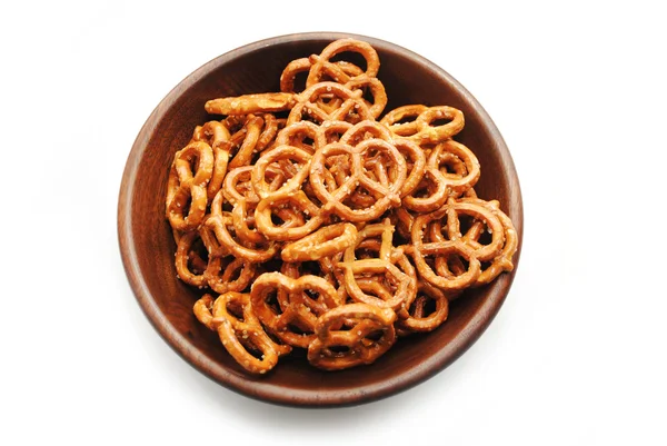 Pretzels in a Round Wooden Bowl Over White — Stock Photo, Image