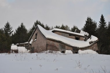Collapsed House Covered with Heavy Winter Snow clipart