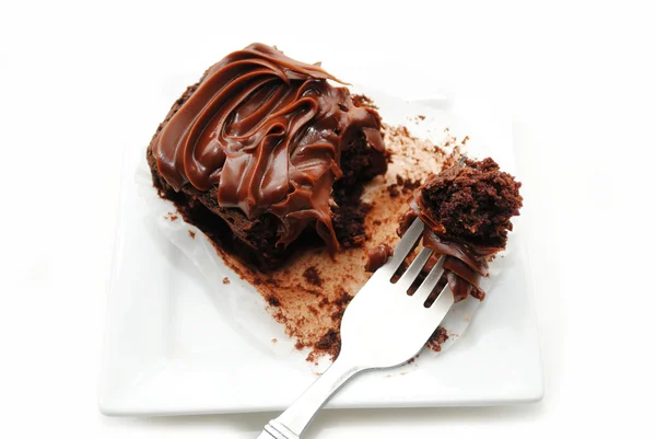 Comer un delicioso brownie con un tenedor —  Fotos de Stock