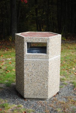 Stone Garbage Container in a Public Park clipart