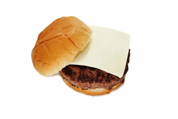 Amerikaanse kaas Slice op een sappige Hamburger — Stockfoto