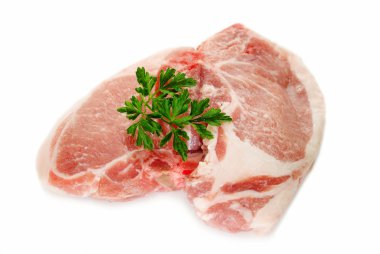 Raw Pork Chops with Parsley Over White clipart