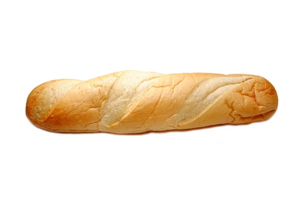 Целая буханка французского хлеба поверх белого — стоковое фото
