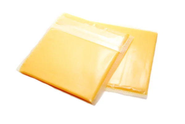 Two Slices of Packaged Cheese — Stock Photo, Image