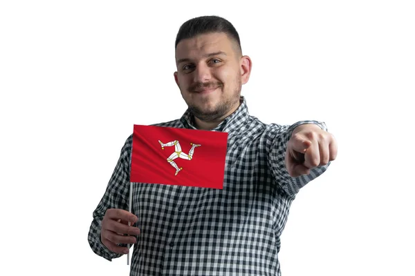 White guy holding a flag of Isle of Man and points forward in front of him isolated on a white background — Stock Photo, Image
