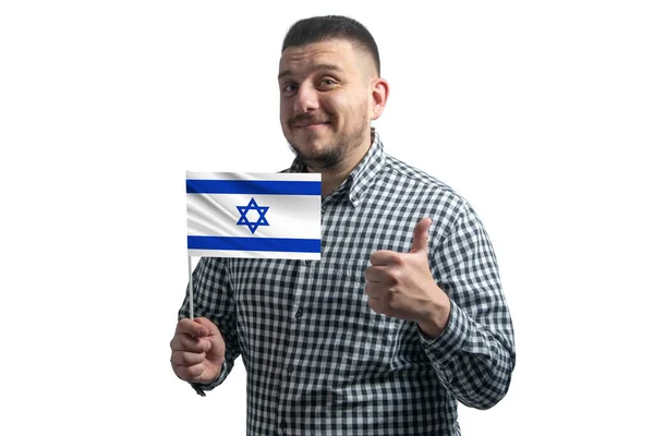 White guy holding a flag of Israel and shows the class by hand isolated on a white background. Like for Israel — Stock Photo, Image