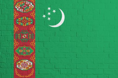Türkmenistan bayrağı. Türkmenistan bayrağının tuğla duvar dokusu.
