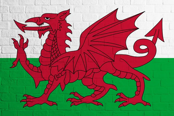Flag of Wales. Brick wall texture of the flag of Wales.