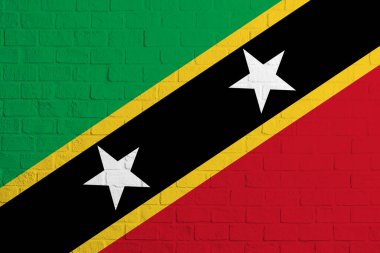 St. Kitts ve Nevis bayrağı. St. Kitts ve Nevis bayrağının tuğla duvar dokusu..