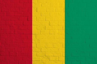 Gine bayrağı. Gine bayrağının tuğla duvar dokusu.