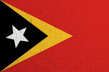 Doğu Timor bayrağı. Doğu Timor bayrağının tuğla duvar dokusu.
