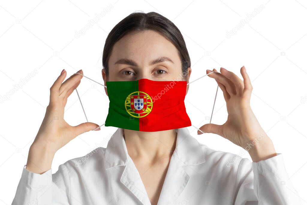 Respirator with flag of Portugal Doctor puts on medical face mask isolated on white background.