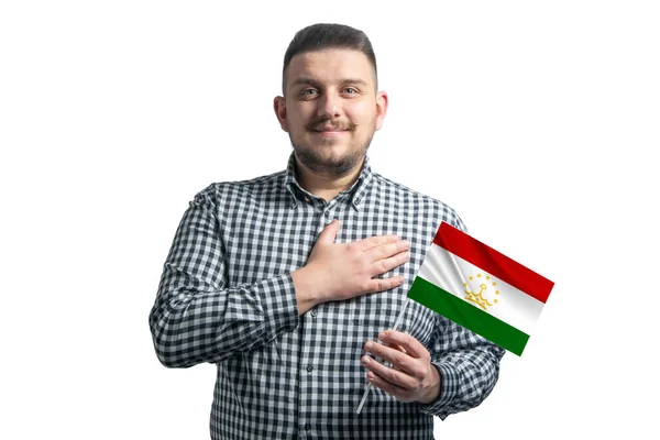 Branco Segurando Uma Bandeira Tajiquistão Segura Mão Seu Coração Isolado — Fotografia de Stock