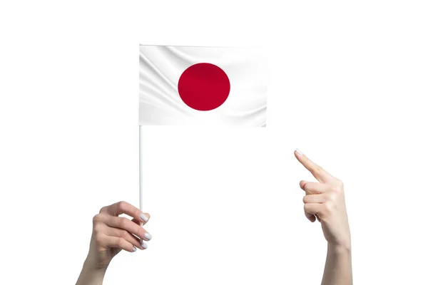 Una Hermosa Mano Femenina Sostiene Una Bandera Japón Que Muestra — Foto de Stock