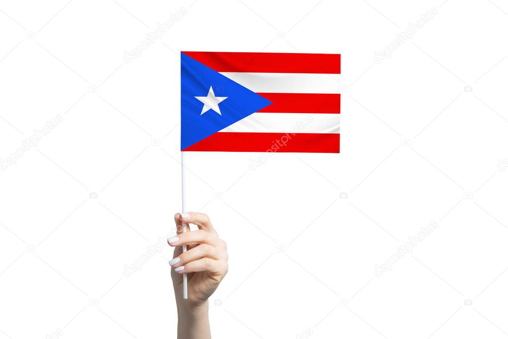 Beautiful female hand holding Puerto Rico flag, isolated on white background.