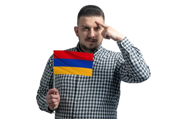 アルメニアの国旗を持っている白人と指が白い背景に孤立した頭の上に寺院に触れる — ストック写真