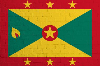 Grenada bayrağı. Grenada bayrağının tuğla duvar dokusu.