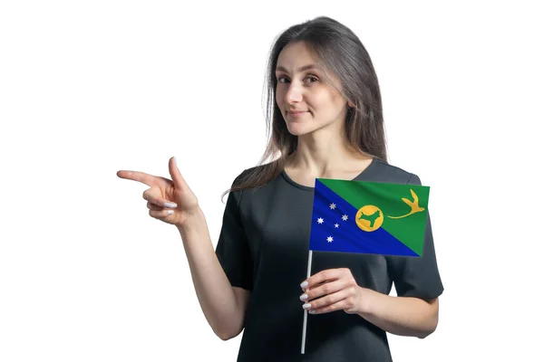 Happy Young White Woman Holding Flag Christmas Island Points Left — Stock Photo, Image