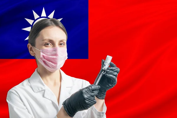 Girl doctor prepares vaccination against the background of the Republic of China flag. Vaccination concept Republic of China.