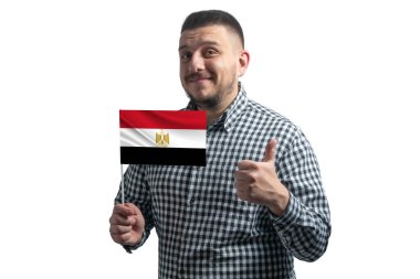 White guy holding a flag of Egypt and shows the class by hand isolated on a white background. Like for Egypt.