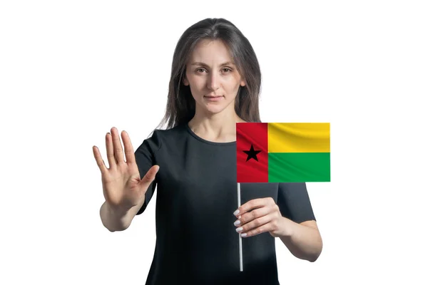 Happy Young White Woman Holding Flag Guinea Bissau Serious Face — ストック写真
