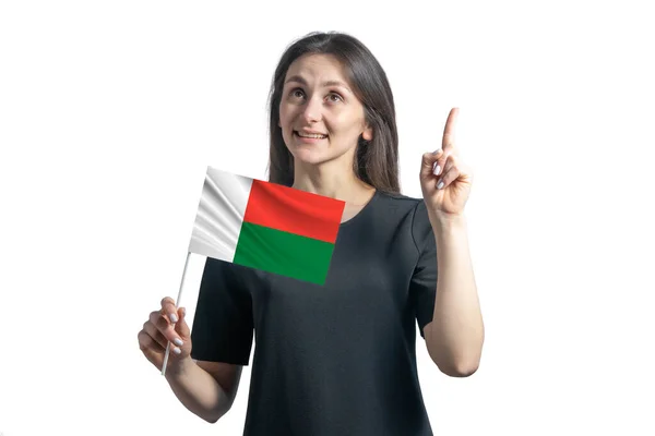 Happy Young White Woman Holding Flag Madagascar Points Thumbs Isolated — Foto de Stock