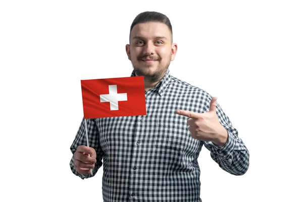 Белый Парень Держит Флаг Швейцарии Указывает Пальцем Другой Руки Флаг — стоковое фото