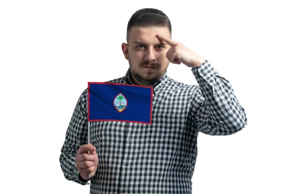 White Guy Holding Flag Guam Finger Touches Temple Head Isolated — Stockfoto