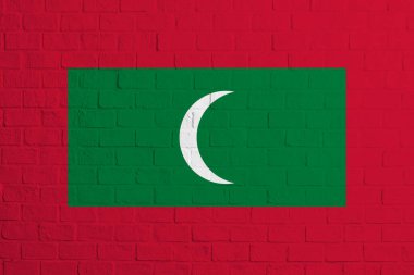 Maldivler bayrağı. Maldivler bayrağının tuğla duvar dokusu.