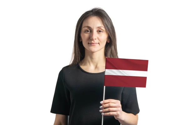 Beyaz Arka Planda Letonya Bayrağı Taşıyan Mutlu Beyaz Kız — Stok fotoğraf