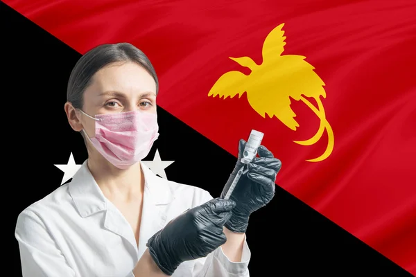 Ärztin Bereitet Impfung Vor Dem Hintergrund Der Flagge Papua Neuguineas — Stockfoto