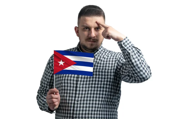 White Guy Holding Flag Cuba Finger Touches Temple Head Isolated — Stock Photo, Image