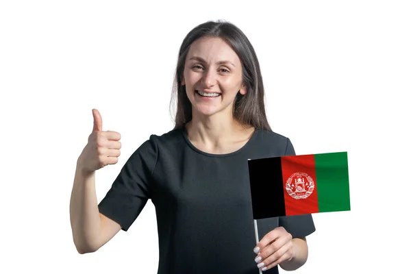 アフガニスタンの国旗を掲げた幸せな若い白人女性が白い背景に手で孤立して授業を見せる — ストック写真