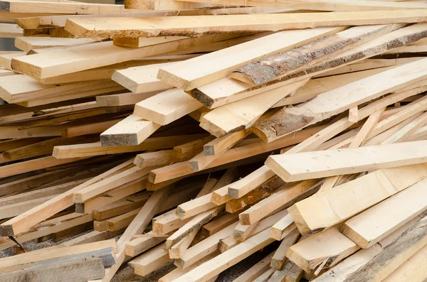 Background of stack wood boards in warehouse